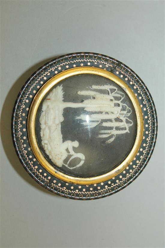 A 19th century green lacquered gold pique work circular snuff box, 3in.